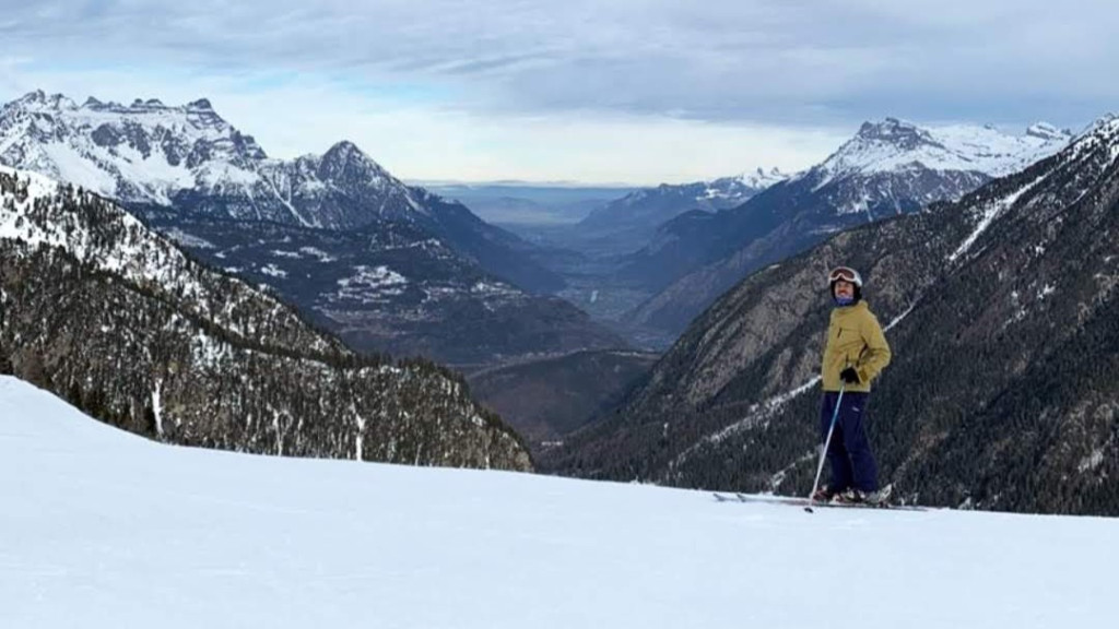 Snow-covered valley and mountains seen from the ski area